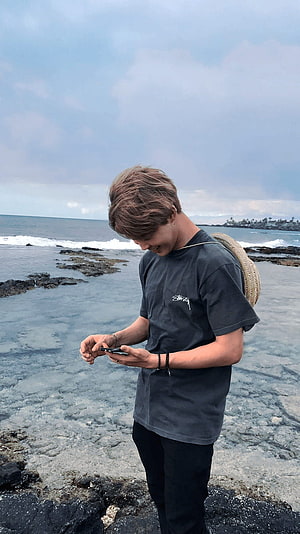 Park Jimin BTS Aesthetic Portrait on a Tropical Rocky Shoreline HD phone wallpaper