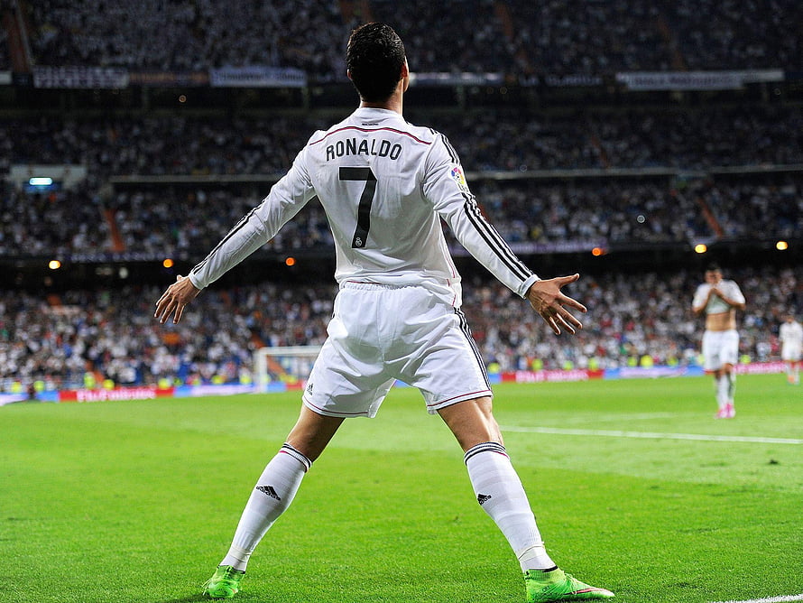 Cristiano Ronaldo in Real Madrid Kit Celebrating on the Pitch HD wallpaper