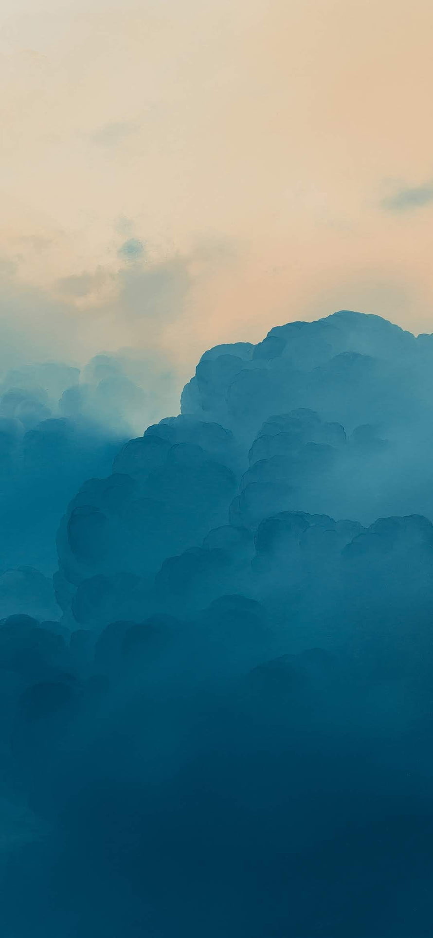 Serene Blue Clouds Against a Soft Peach Sky at Dusk HD phone wallpaper