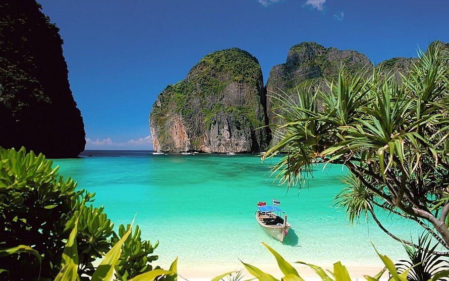 Tropical Thailand Beach with Turquoise Water, Longtail Boat, and Lush Limestone Cliffs HD wallpaper