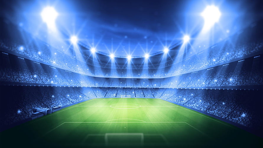 UEFA Champions League Stadium at Night with Bright Floodlights and Full Crowd HD wallpaper