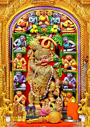 Kashtbhanjandev Temple Deity with Vanara Figures in Ornate Golden Frame HD phone wallpaper
