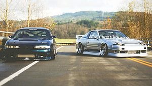 Two Modified JDM Sports Cars Parked on a Scenic Country Road HD wallpaper