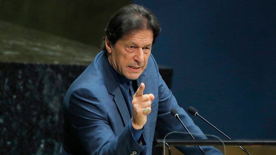 Imran Khan Delivering a Speech at a Formal Podium in a Blue Suit HD wallpaper