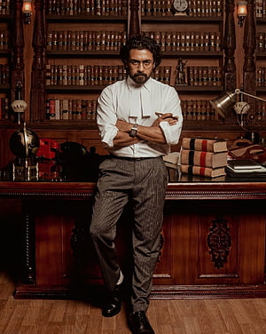 Suriya as Lawyer in Jai Bhim Film Still with Legal Robes and Bookshelf HD phone wallpaper