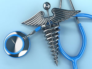 Blue Stethoscope and Silver Caduceus Medical Symbol on Light Blue Background HD wallpaper