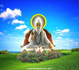 Sant Kabir Meditating in a Serene Green Meadow with a Golden Halo HD wallpaper
