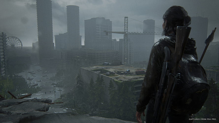 Ellie overlooking a ruined cityscape in The Last of Us Part 2 HD wallpaper