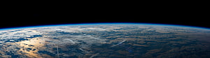 Earth Horizon From Orbit With Blue Atmosphere And Clouds Against Black Space HD wallpaper