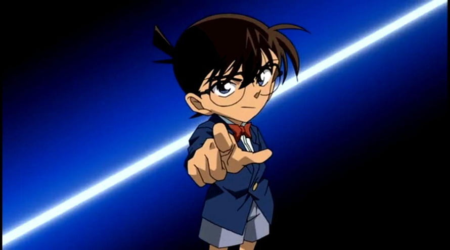 Conan Edogawa from Detective Conan Pointing Forward in a Dynamic Blue Scene HD wallpaper