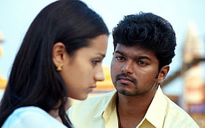 Vijay and Trisha in a dramatic close-up from the Tamil film Ghilli HD wallpaper