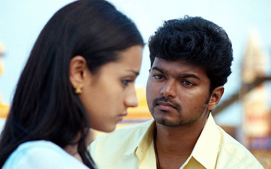 Vijay and Trisha in a dramatic close-up from the Tamil film Ghilli HD wallpaper