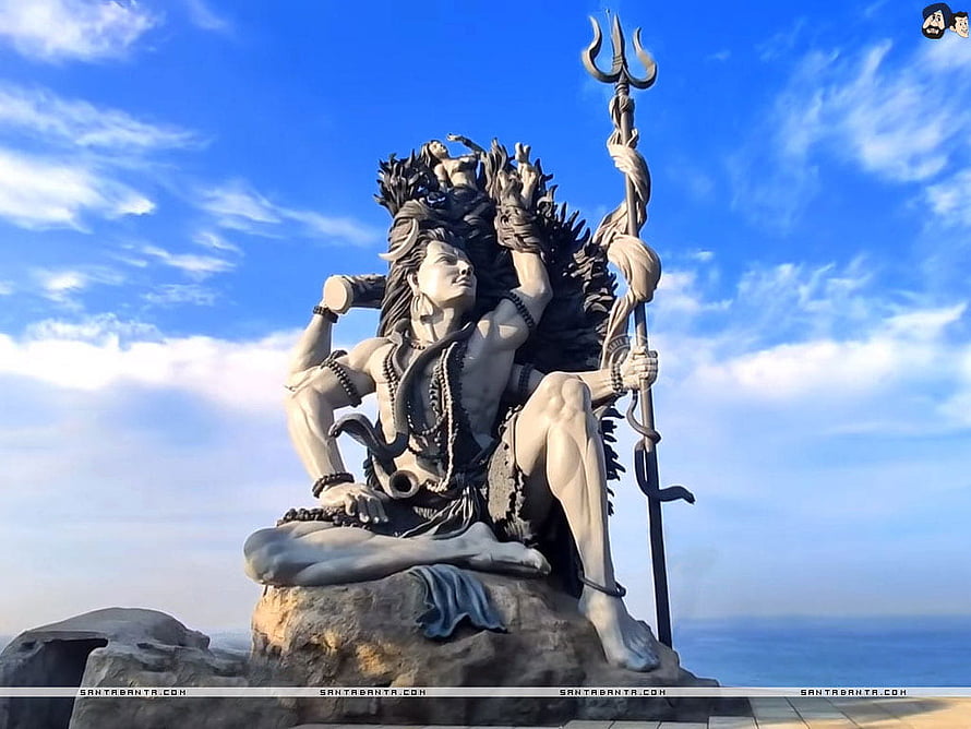 Azhimala Shiva Statue Seated on Rock with Trishula and Serpents Against Blue Sky HD wallpaper