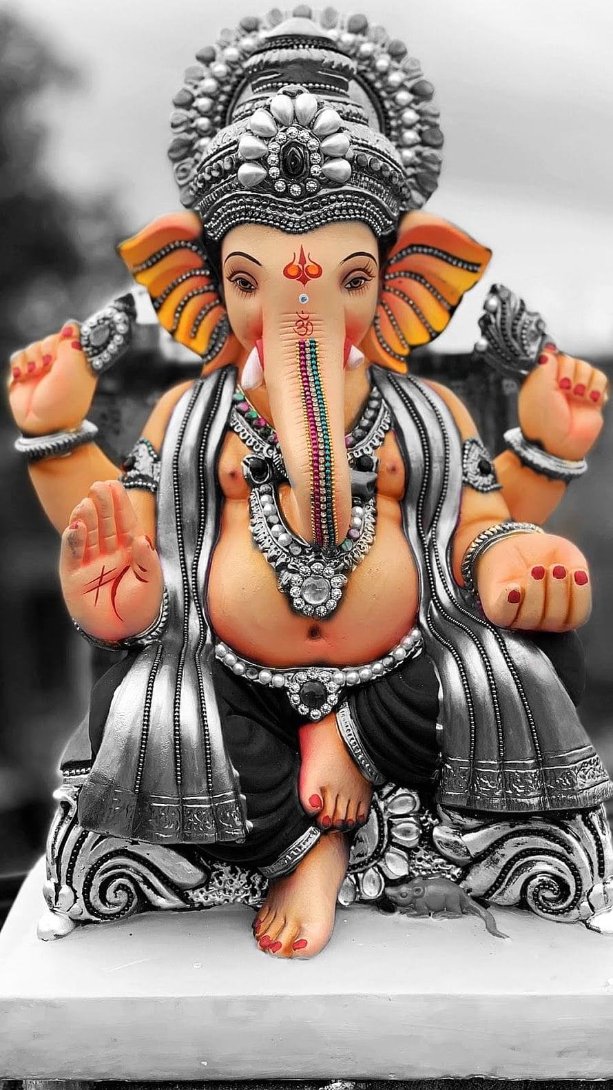 Ganesha Idol with Silver Ornamentation and Colorful Trunk Detail HD phone wallpaper