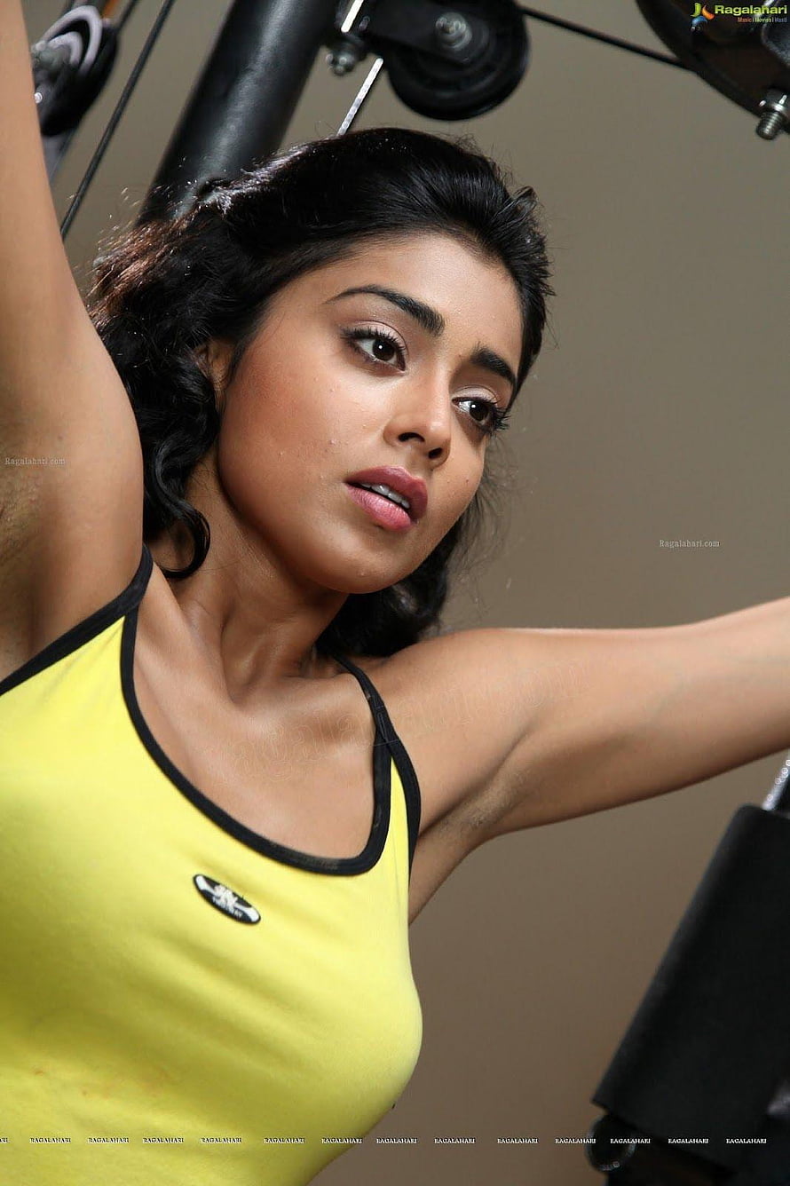 Woman in yellow tank top exercising on gym equipment with arms raised, hot armpit,actress armpit,indian armpit,actress armpit ,hairy, indian armpits HD phone wallpaper