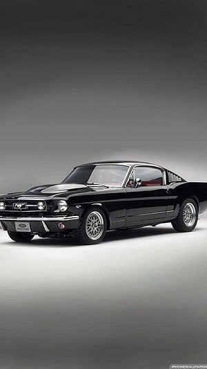 Classic Black Ford Mustang Fastback Studio Shot with Chrome Wheels and Racing Badge HD phone wallpaper