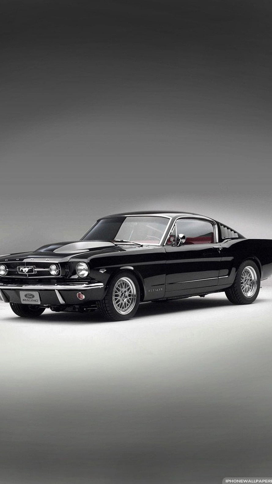 Classic Black Ford Mustang Fastback Studio Shot with Chrome Wheels and Racing Badge HD phone wallpaper