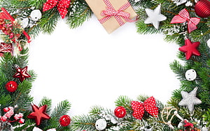 Festive Christmas border with pine branches, red and silver stars, and gift boxes on white background HD wallpaper