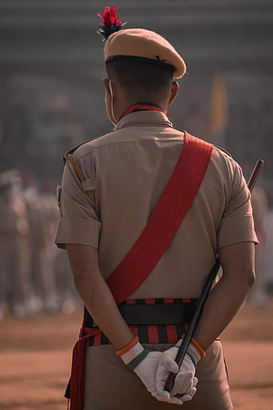 Rear View of Indian Police Officer in Ceremonial Uniform with Red Sam Browne Belt HD phone wallpaper