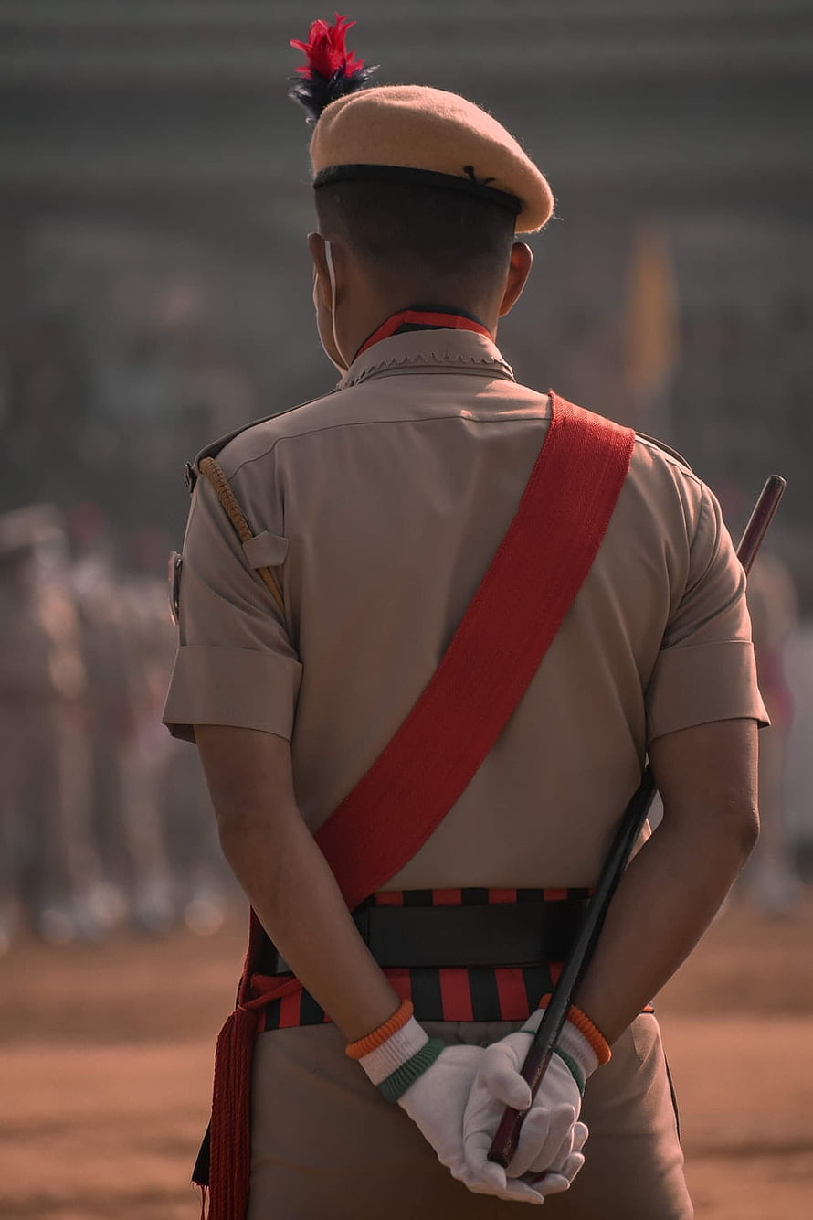 Rear View of Indian Police Officer in Ceremonial Uniform with Red Sam Browne Belt HD phone wallpaper