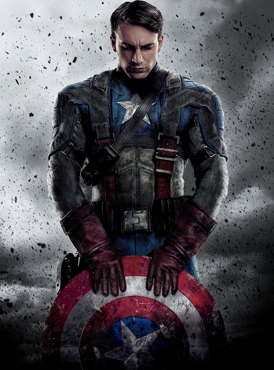 Captain America in battle-worn tactical suit holding shield against gritty debris backdrop HD phone wallpaper