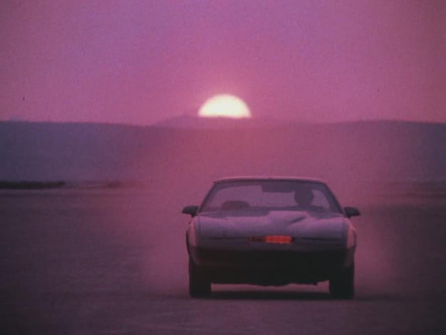 Knight Rider KITT Car Driving on Desert Road at Sunset with Purple Sky HD wallpaper