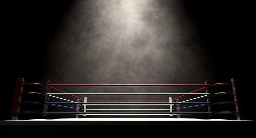 Empty Boxing Ring Under Dramatic Spotlight in Dark Arena HD wallpaper