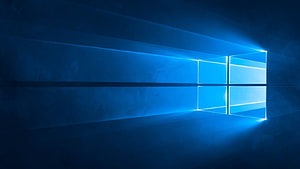Windows 10 Default Blue Window Logo Wallpaper with Light Rays and Dark Background HD wallpaper