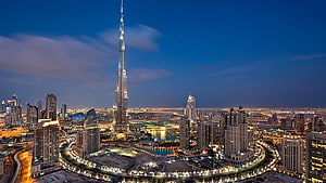 Burj Khalifa and Dubai Cityscape at Dusk with Illuminated Skyline HD wallpaper