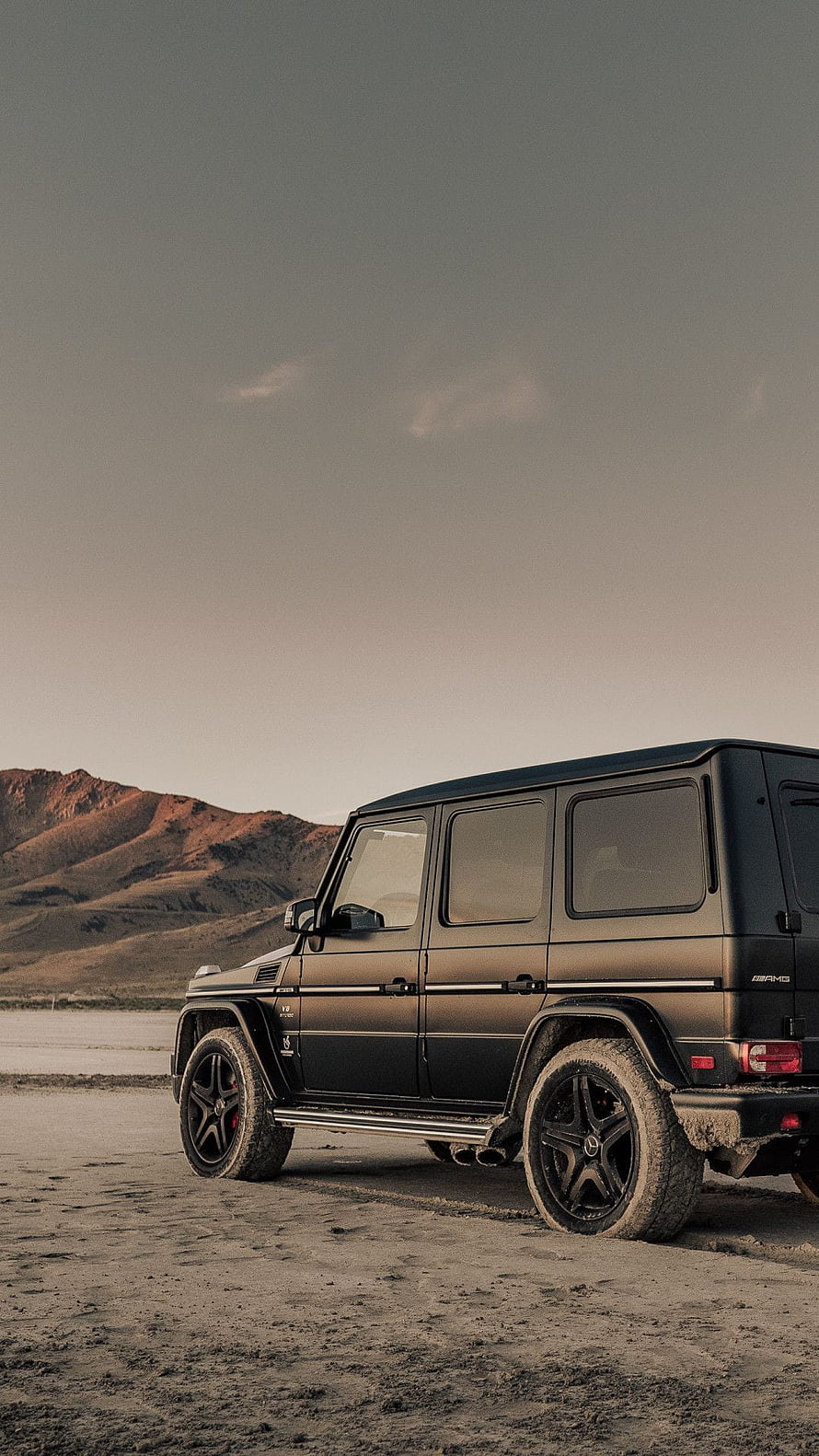Mercedes-AMG G63 Wagon Parked on Desert Terrain at Dusk HD phone wallpaper