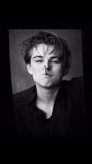 Leonardo DiCaprio Black and White Portrait with Film Strip Border HD phone wallpaper