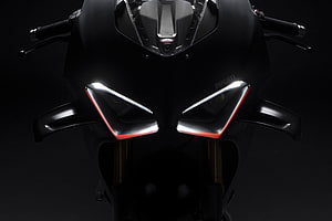 Ducati Panigale V4 SP2 Front Headlight Close-Up in Matte Black with Red Accents HD wallpaper