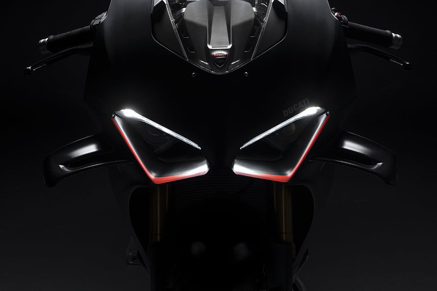 Ducati Panigale V4 SP2 Front Headlight Close-Up in Matte Black with Red Accents HD wallpaper