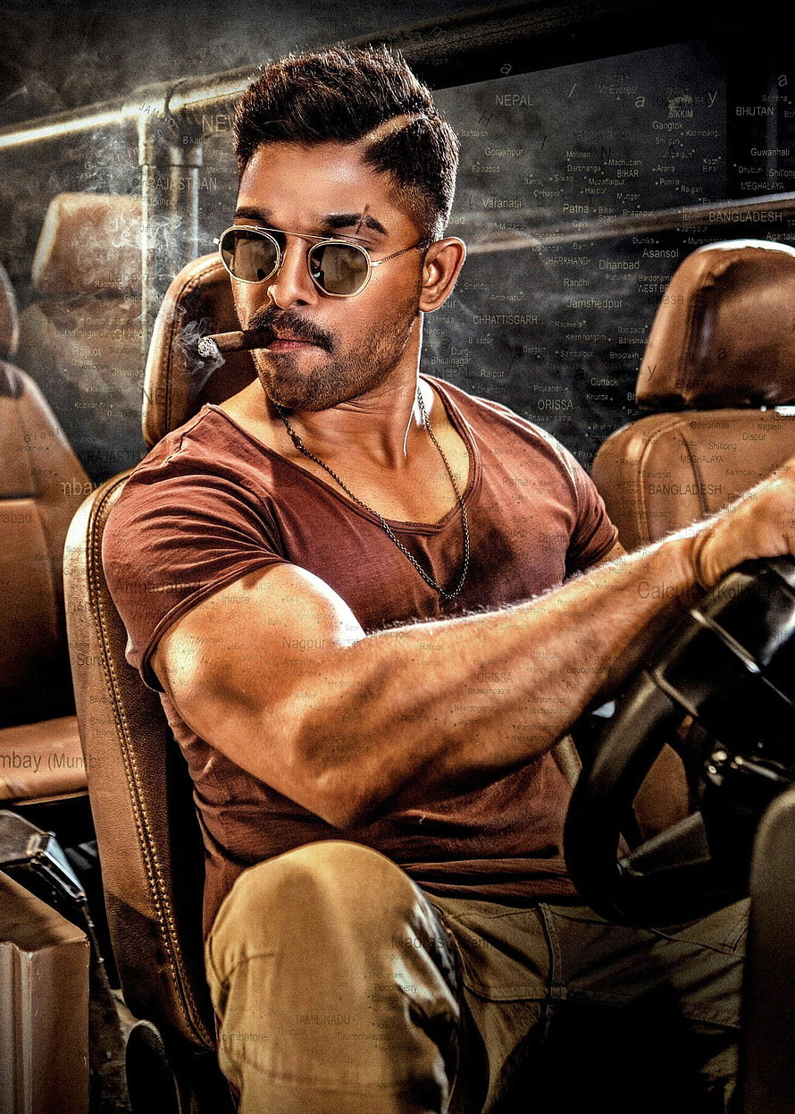 Allu Arjun in Aviator Sunglasses and Brown Tee Smoking a Cigar in a Car HD phone wallpaper