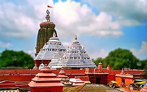 Jagannath Temple Puri India with Red Flag and White Shikharas Against Blue Sky HD wallpaper