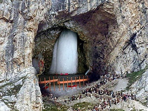 Amarnath Cave Temple with Pilgrims and Natural Ice Shiva Lingam in Himalayan Mountain HD wallpaper