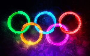 Vibrant Neon Olympic Rings Glowing Against Dark Geometric Background HD wallpaper