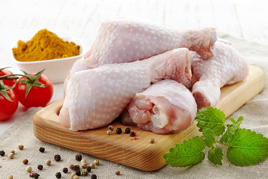 Raw Chicken Drumsticks on Wooden Board with Fresh Herbs and Spices HD wallpaper