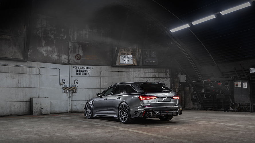 ABT Audi RS6 Avant Performance Wagon in Industrial Garage Setting HD wallpaper