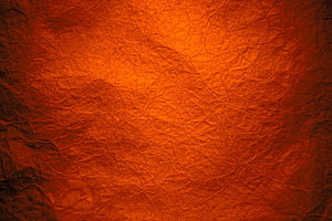 Burnt Orange Crumpled Paper Texture with Warm Amber and Rust Tones HD wallpaper