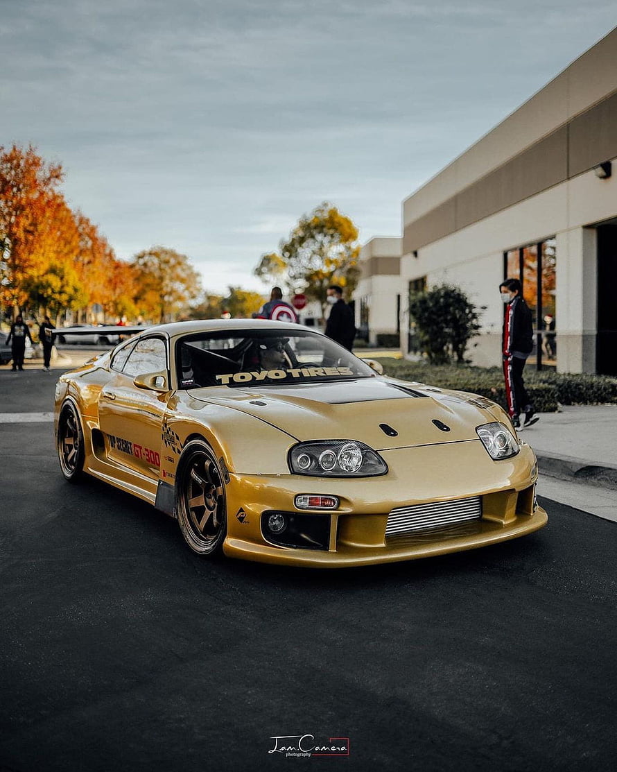 Gold Toyota Supra MK4 Widebody Build with Toyo Tires Decal and Custom Front Bumper HD phone wallpaper