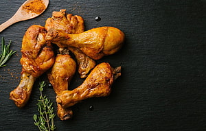 Roasted Chicken Legs with Rosemary and Curry Powder on Dark Slate HD wallpaper