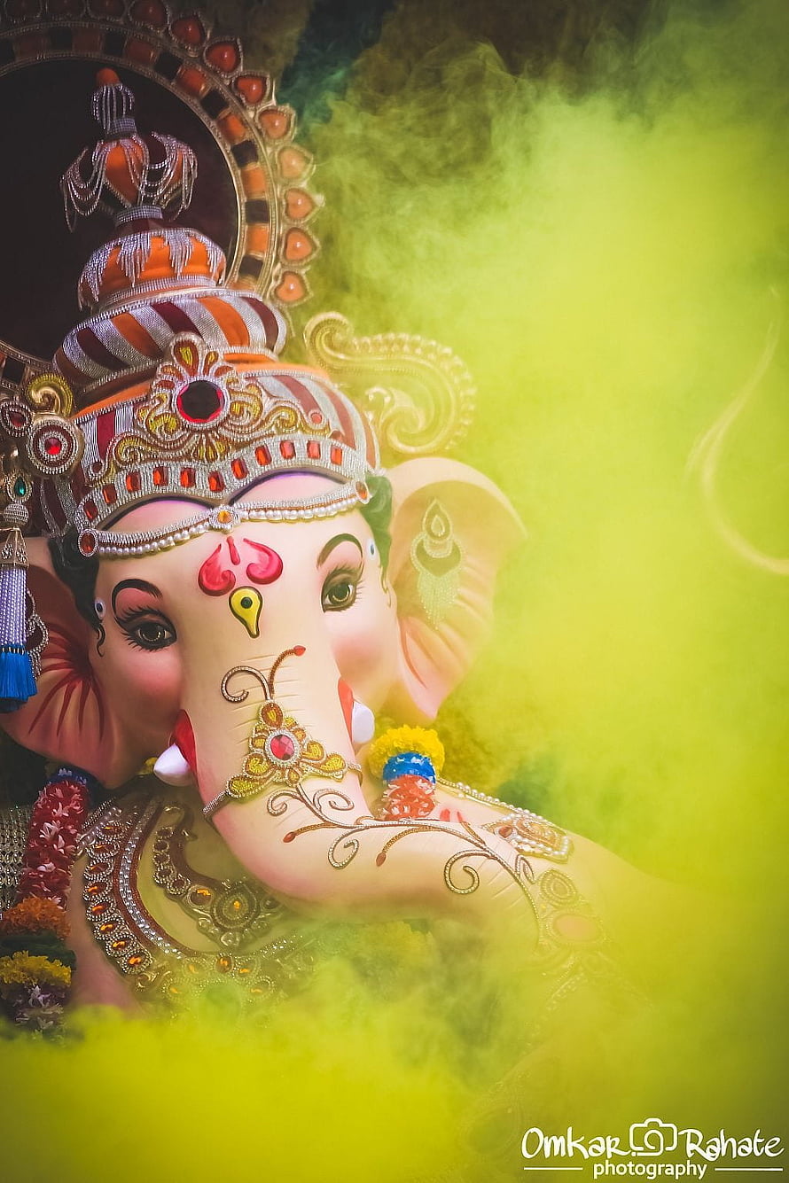Ornate Ganesha Portrait With Golden Crown And Vibrant Yellow Smoke HD phone wallpaper