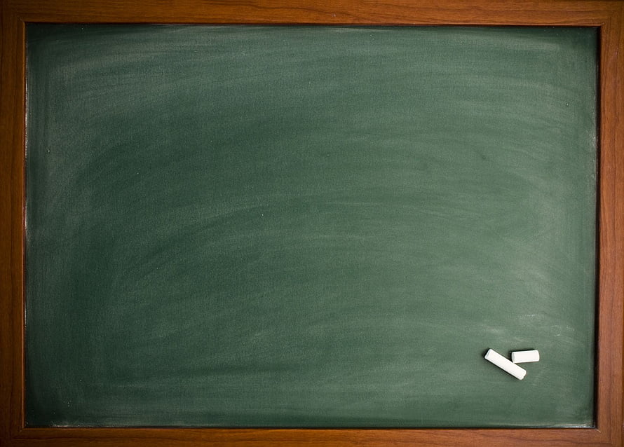 Empty Green Chalkboard with Wooden Frame and Chalk Pieces HD wallpaper