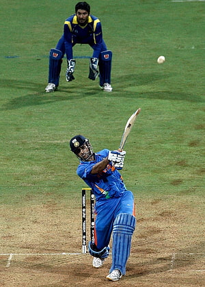 Indian cricketer executing a powerful shot during a 2011 World Cup match HD phone wallpaper