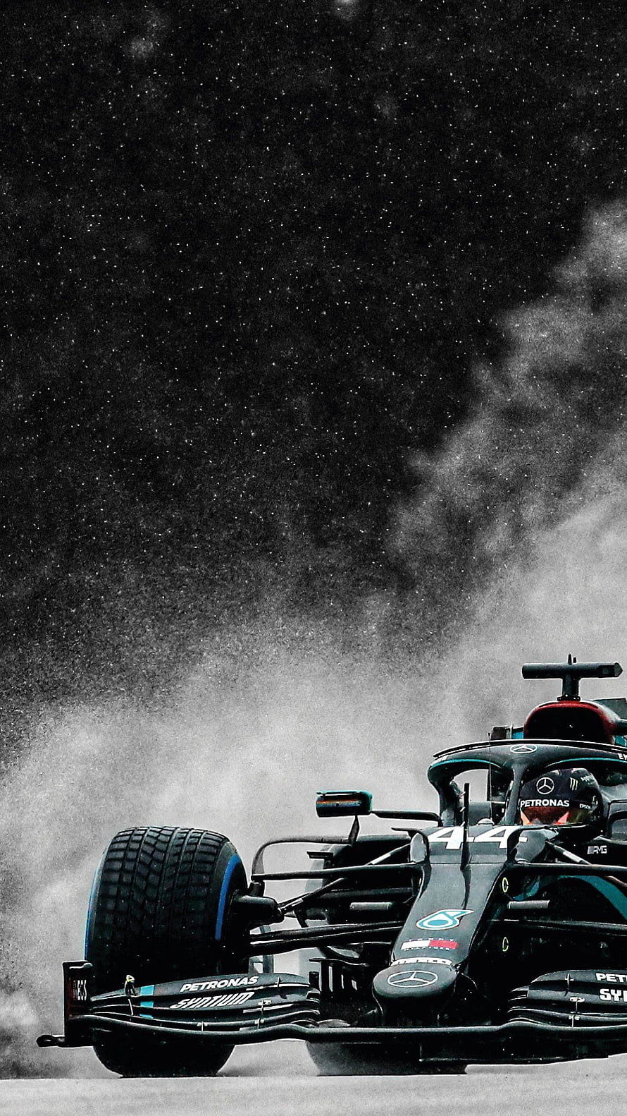 Mercedes F1 W11 race car kicking up spray on a wet track with Lewis Hamilton at the wheel HD phone wallpaper