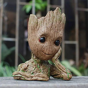 Baby Groot Resin Statue with Wood Grain Texture and Red Eyes HD phone wallpaper