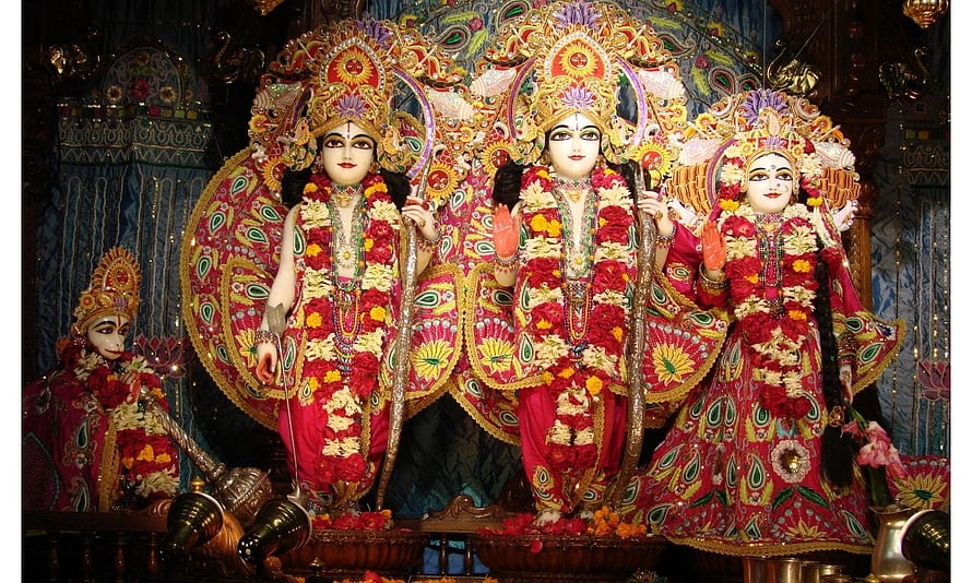 Lord Rama, Sita, and Lakshmana adorned in vibrant floral garlands and ornate temple regalia HD wallpaper