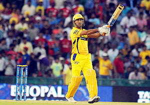 MS Dhoni in Chennai Super Kings yellow kit executing a cricket shot during an IPL match HD wallpaper
