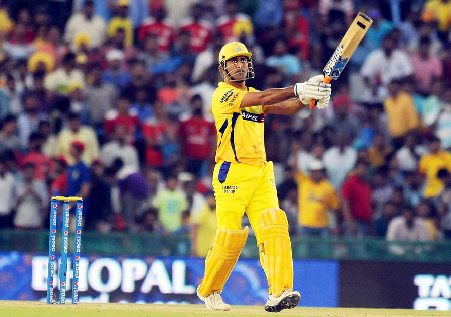 MS Dhoni in Chennai Super Kings yellow kit executing a cricket shot during an IPL match HD wallpaper